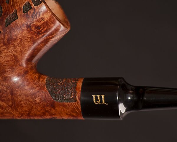 Gold Armenian initials inlaid on a black stem